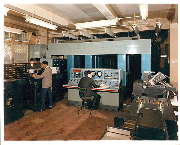 II/I with Stephen Knowles at the console, Peter Taverner behind the printer and Michael ?? checking the printout 